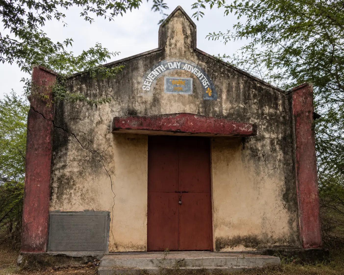 Weathered Seventh-day Adventist village church facade